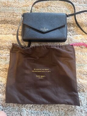 kate spade black leather envelope crossbody bag with gold logo with dust cover